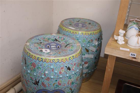 A pair of 19th century Chinese famille rose enamelled garden seats (a.f.)